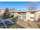 View of multi-Gathering apartment building with lush lawn, balconies, and easy access to parking at 765 S Alton Way # 6B, Denver, CO 80247