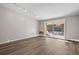 Bright living room boasts modern flooring and sliding doors leading to a balcony at 765 S Alton Way # 6B, Denver, CO 80247
