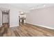 Open-concept living area featuring wood floors and an entrance to the kitchen at 765 S Alton Way # 6B, Denver, CO 80247