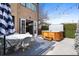 Inviting backyard with hot tub, patio table, and bistro lights for entertaining at 4170 Vrain St, Denver, CO 80212
