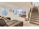 Finished basement featuring modern design elements, a plush couch, and a convenient beverage center at 4170 Vrain St, Denver, CO 80212