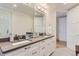 Modern bathroom with dual sinks, large mirror, vanity, and drawers at 4170 Vrain St, Denver, CO 80212