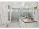 Bright bathroom features dual sinks, modern vanity, and walk-in shower at 4170 Vrain St, Denver, CO 80212