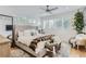 Bright, spacious bedroom featuring hardwood floors, ceiling fan and large windows at 4170 Vrain St, Denver, CO 80212