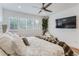 Sunlit bedroom features hardwood floors and modern ceiling fan and lighting at 4170 Vrain St, Denver, CO 80212