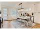 Bright dining room featuring modern lighting, elegant decor and natural light streaming through shuttered windows at 4170 Vrain St, Denver, CO 80212