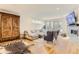 Comfortable living room featuring a plush sectional, stylish seating, stone fireplace and access to outdoor space at 4170 Vrain St, Denver, CO 80212