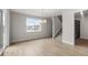 Bright dining area with light wood floors, a modern chandelier, and views of the neighborhood at 4543 Cholla Trl, Castle Rock, CO 80104