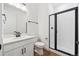 Clean bathroom features modern vanity, sleek fixtures, and glass-enclosed shower at 1131 Joseph Pl, Erie, CO 80026