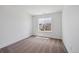 Bright bedroom with plush carpeting and a large window offering neighborhood views at 1131 Joseph Pl, Erie, CO 80026