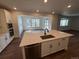 Modern kitchen featuring a large island, stainless steel appliances, and plenty of cabinet space at 1131 Joseph Pl, Erie, CO 80026