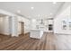 Bright kitchen features stainless steel appliances, a center island, and ample cabinet space for storage at 1131 Joseph Pl, Erie, CO 80026