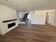 Spacious living room features wood floors, a fireplace, and plenty of natural light at 1131 Joseph Pl, Erie, CO 80026