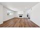 Bright and airy living room boasts modern fireplace, hardwood floors, and large windows offering plenty of natural light at 1131 Joseph Pl, Erie, CO 80026