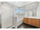 Bright bathroom features a double sink vanity, separate shower and tub at 15378 E 99Th Way, Commerce City, CO 80022