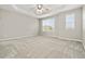 Spacious bedroom features neutral carpet and natural light from large window at 15378 E 99Th Way, Commerce City, CO 80022