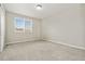 Neutral bedroom features a large window with blinds and neutral carpet at 15378 E 99Th Way, Commerce City, CO 80022