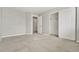 Neutral bedroom featuring plush carpeting, closet, and ensuite bathroom access at 15378 E 99Th Way, Commerce City, CO 80022