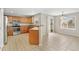 Bright eat-in kitchen with stainless steel appliances and sliding glass door to the backyard at 15378 E 99Th Way, Commerce City, CO 80022