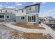 Two-story home with a modern exterior, patio, and freshly landscaped backyard at 8414 Vona Ln, Littleton, CO 80125