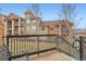 Balcony with wrought iron railing and a view of the neighborhood complex at 10056 W Unser Dr # 204, Littleton, CO 80127