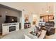 Spacious living room with open layout to kitchen and dining, featuring a cozy entertainment area at 10056 W Unser Dr # 204, Littleton, CO 80127
