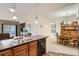Bright living space including the kitchen, dining area, and access to the living room, creating an open atmosphere at 10056 W Unser Dr # 204, Littleton, CO 80127