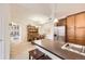 Inviting living space with kitchen island, stainless steel appliances, dining table and chairs at 10056 W Unser Dr # 204, Littleton, CO 80127
