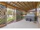 Enclosed back porch with hot tub and vaulted wood ceilings at 21593 Hill Gail Way, Parker, CO 80138