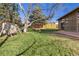 Large backyard with a swing set and mature trees, offering a serene and playful outdoor space at 21593 Hill Gail Way, Parker, CO 80138
