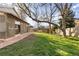 Backyard view of the back of the home and a small storage shed at 21593 Hill Gail Way, Parker, CO 80138
