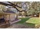 Spacious backyard with a well-maintained lawn, a charming patio, and a beautiful flowering tree providing shade at 21593 Hill Gail Way, Parker, CO 80138
