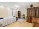 Cozy bedroom with vintage furniture, wood-look floors, and a comfortable bed, creating a warm and inviting space at 21593 Hill Gail Way, Parker, CO 80138