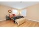 Bedroom with hardwood flooring, natural light, and neutral decor at 21593 Hill Gail Way, Parker, CO 80138