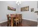 Dining room with wood table and art at 21593 Hill Gail Way, Parker, CO 80138