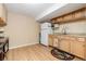 A functional kitchenette with wood cabinets, essential appliances, and light-colored walls for a bright space at 21593 Hill Gail Way, Parker, CO 80138