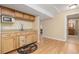 Well-lit kitchenette featuring wood cabinetry, modern appliances, and easy access to the adjacent spaces at 21593 Hill Gail Way, Parker, CO 80138
