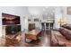 The open floor plan features hardwood floors, vaulted ceilings and a breakfast bar at 21593 Hill Gail Way, Parker, CO 80138