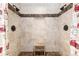 Walk-in shower with dual shower heads and travertine tile surround at 21593 Hill Gail Way, Parker, CO 80138