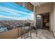 Balcony with city views has chairs and sliding door to bedroom at 800 N Pearl St # 1211, Denver, CO 80203