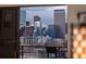Fantastic city view featuring stunning skyscrapers and Denver's unique architectural skyline, seen through a sliding glass door at 800 N Pearl St # 1211, Denver, CO 80203