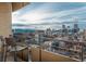 Balcony view of the city skyline and distant mountains, offering a picturesque vista from the residence at 800 N Pearl St # 1211, Denver, CO 80203