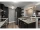 Open kitchen with granite countertops, stainless steel appliances, and a breakfast bar at 800 N Pearl St # 1211, Denver, CO 80203