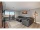 Spacious living room with fireplace, and sliding glass doors opening to a balcony showcasing a city view at 800 N Pearl St # 1211, Denver, CO 80203
