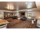 Comfortable lounge area featuring stylish seating, bar, television and contemporary lighting fixture at 800 N Pearl St # 1211, Denver, CO 80203