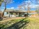 Spacious backyard with patio, shed, and grassy area at 886 Kenton St, Aurora, CO 80010