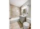 Clean bathroom with a bathtub, toilet and vanity at 886 Kenton St, Aurora, CO 80010