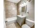 Clean bathroom with a bathtub, toilet and vanity at 886 Kenton St, Aurora, CO 80010