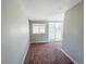 Bedroom with carpet, sliding glass door to backyard at 886 Kenton St, Aurora, CO 80010