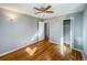 Spacious bedroom with hardwood floors and ceiling fan at 886 Kenton St, Aurora, CO 80010